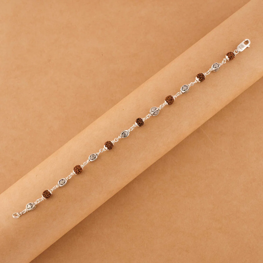 Silver Rakhi with Rudraksha and Hollow Circular Beads - Image 4