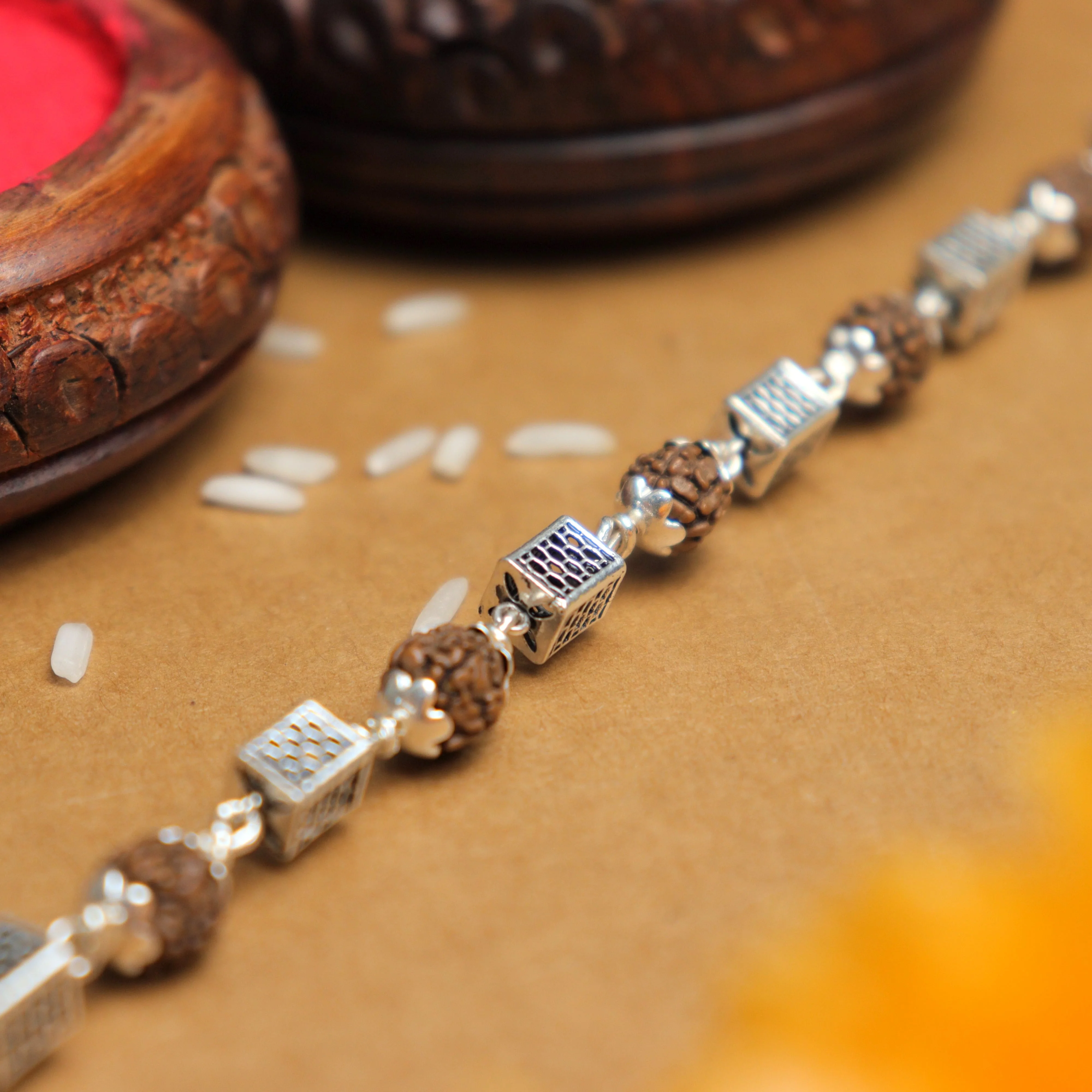 Silver Rakhi with Square Cylinder Rudraksha Beads